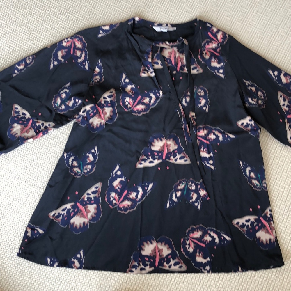 Tucker silk blouse.